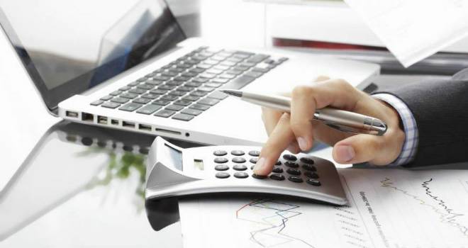 Kensington launches new remortgage portal in partnership with Koodoo calculator paperwork business office work laptop