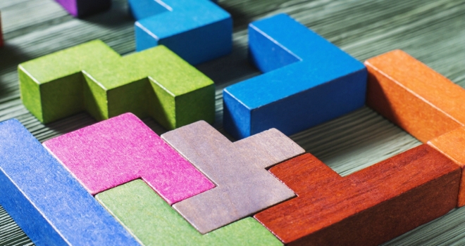 finova Broker partners with Norton Broker Services wood blocks join add build create new