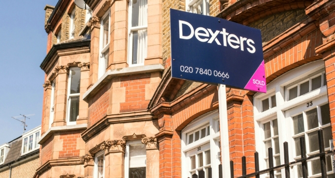 Annual house price growth subdued at 0.4%: Nationwide House for sale sign sold