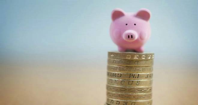 33% under financial pressure after bailing kids out pig saving coins stack save isa bond