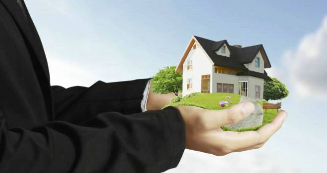 Mortgage firm launches 'large mortgage' advice service businessman house home protection cover insurance