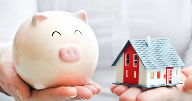 Average property price dips below pre-crisis peak house and savings pig
