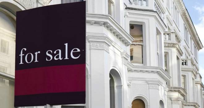 Soaring house prices push 4.3m homes into a higher stamp duty bracket for sale sign white houses