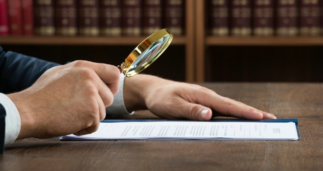What areas of regulation should firms keep an eye on in 2020? regulation magnifying glass legal paper