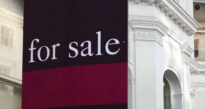 Early house price cuts climb across Britain ahead of Budget for sale sign white houses