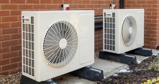 Ecology BS launches mortgage cashback offer for heat pump installations Two air source heat pumps installed on the exterior of a modern house