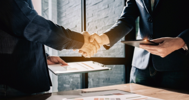 Twenty7tec acquires Meet Parker deal agreement business hand handshake acquire