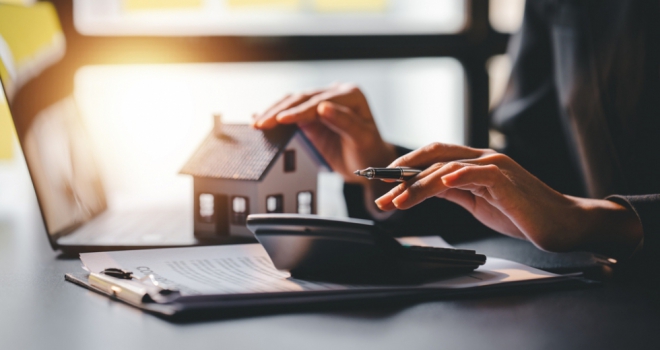 Number of self-employed applicants experiencing mortgage rejection drops significantly house calculator broker adviser paper approve sign