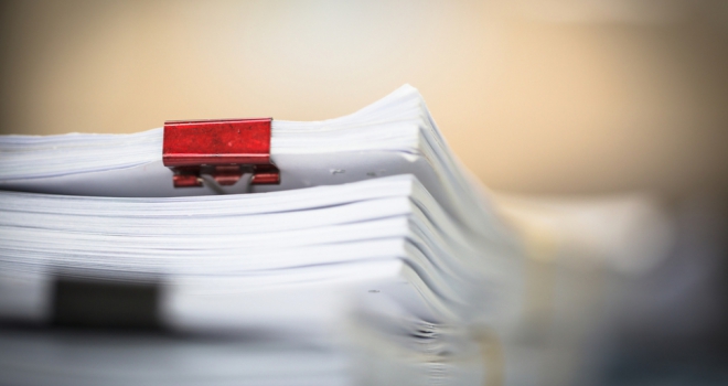 Post-completion conveyancing work  legal paperwork with binder clips