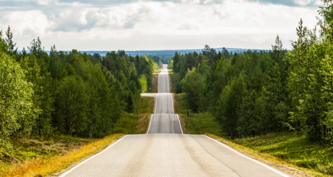 winding road ahead with up and down bumps