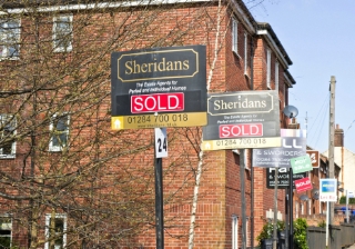House price growth slows amid Budget uncertainty: Nationwide  For sale sold signs house