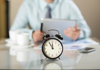 Bridging completion times down 23% in 2024 timing clock businessman