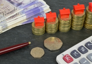 Fewer equity release customers using property wealth to pay off mortgage debt coins houses money