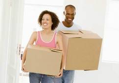 young ftb couple with boxes