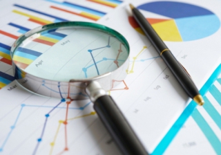 Less than 0.25% of mothers' state pension errors reviewed charts and graphs with magnifying glass