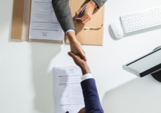 Bain Capital completes acquisition of finova and Iress MSO deal agreement business hand handshake acquire approve buy mortgage