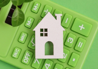 UK banks over-reporting emissions from residential mortgage lending small wooden house in grass