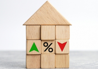 Remortgage boom masks first-time buyer slump in September blocks making up a house with percentage signs up and down