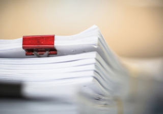 Post-completion conveyancing work  legal paperwork with binder clips