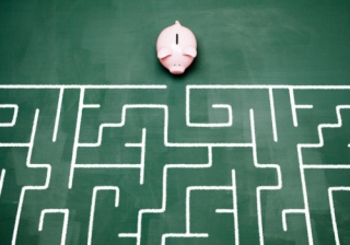 Number of affordable first-time buyer mortgages down by 40% piggy bank maze confused money