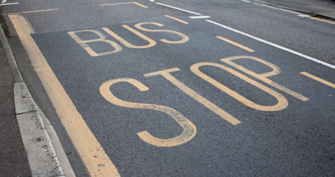 Buyers opt for better transport links over roomier homes bus stop sign written on black tarmac