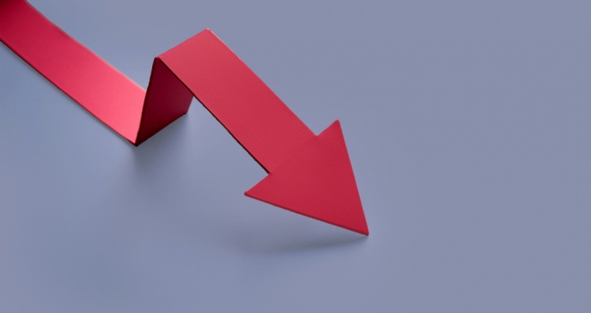 MFS cuts bridging & BTL rates a red paper arrow pointing downwards on a blue background
