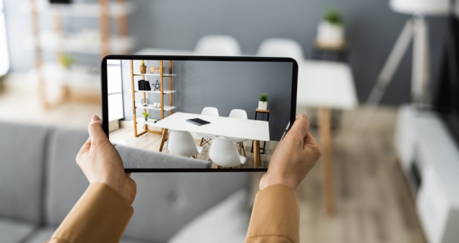 Homes being marketed with no photos in 'rush' to list property pair of hands holding a tablet taking photo of dining room