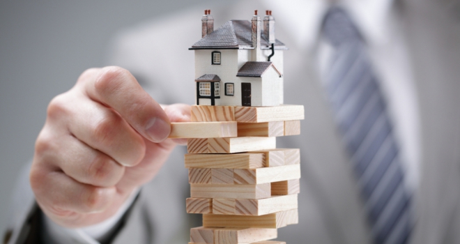 Property transactions down 22% year-on-year: HMRC a house balanced on top of jenga blocks
