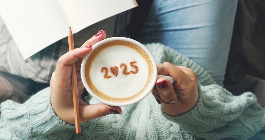 Will first-time buyers strive in 2025? Person holding a cup of coffee with '2025' written in the foam