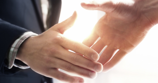 Exeter Finance celebrates ten-year funding partnership with Shawbrook Handshake 56