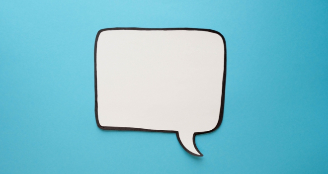 Bank of England cuts base rate: the property industry reacts white speech bubble made of paper on blue background