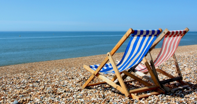 July is most popular month to move home in UK, study reveals summer beach deckchair