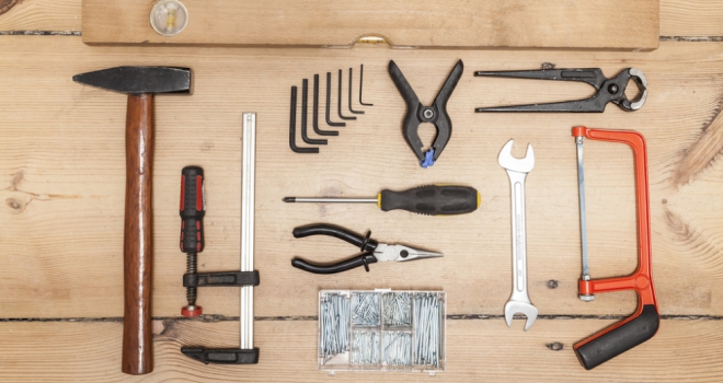 What builders really mean - a jargon-busting guide for homeowners home improvement tools laid out on a wooden background