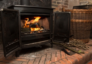 One in ten plan to ditch central heating for real fires this autumn Wood burning stove 744